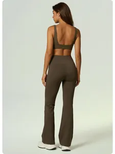 Detailed back view of high-waist flared yoga pants and matching olive green sports bra