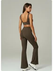 Side-rear view showing the cut and fit of a brown yoga set including sports bra and flare pants