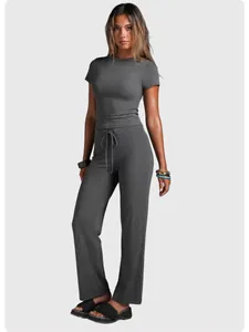 Full view detail of the grey short-sleeve yoga set with high-waist straight leg pants