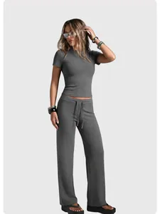 Full look of women's dark grey short-sleeve t-shirt and straight-leg yoga pants set