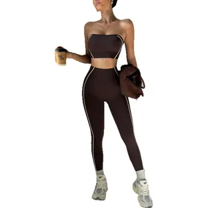 Two-piece brown seamless yoga set with contrast piping tube top and high waist leggings