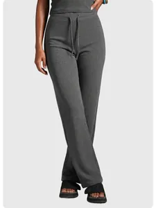 Detailed view of grey ribbed high-waist straight-leg yoga pants featuring a drawstring waist