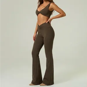 Two-piece yoga set featuring a brown sports bra and high-waist flared fitness pants.