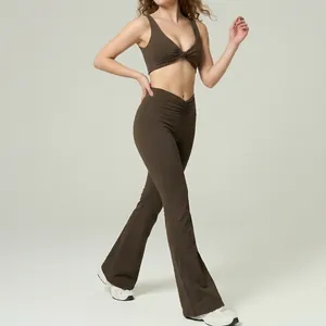 Brown yoga set for women featuring a twisted sports bra and high-waist flared leggings