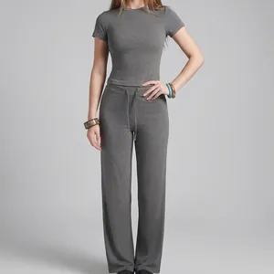 Two-piece grey yoga set with short sleeve top and straight-leg trousers for women