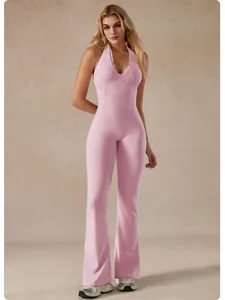 Pink lace V-neck halter yoga jumpsuit with flared pants for fitness and workout