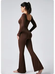 Brown ribbed long-sleeved yoga jumpsuit with flared pants and open back detail