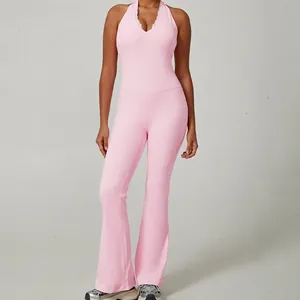 Elegant pink halter yoga jumpsuit with lace V-neck and flared leg design