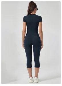 Rear view of the slimming fit of this quick-dry athletic set with cropped leggings