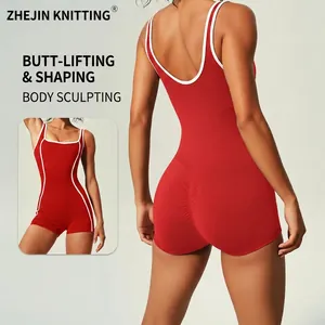 Red one-piece yoga bodysuit for women with white contrast trim and scrunch butt