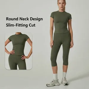 Olive green women's yoga set featuring short sleeve top and high-waist capri leggings