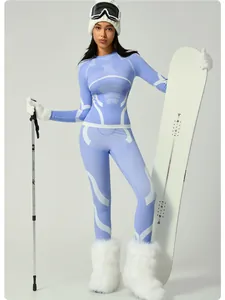 Blue thermal ski base layer set for women with matching leggings and top