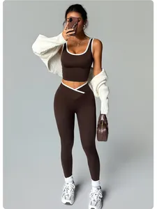 Two-piece brown seamless yoga set with v-waist leggings and contrast trim tank top