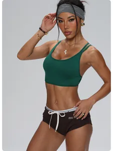 Professional green quick-dry sports bra and brown shorts set for women's fitness yoga