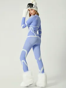 Blue and white patterned women's ski base layer set for winter sports and thermal warmth