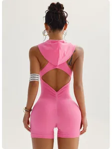 Detailed back view of a pink sleeveless hooded yoga jumpsuit with ribbed fabric texture