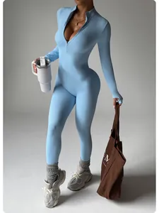 Detailed macro view showing light blue seamless yoga jumpsuit with zip and thumbholes.
