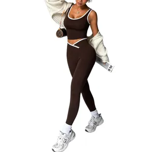 Two-piece seamless brown yoga set with contrast piping crop top and high-waist leggings