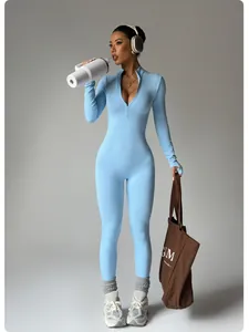 Full-body detail of a seamless long-sleeve light blue yoga jumpsuit with a zipper neckline