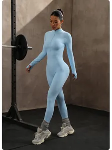 Full length detail of a light blue seamless yoga jumpsuit with a front zipper closure