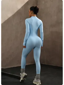 Back view of seamless light blue long sleeve yoga jumpsuit with lifting effect