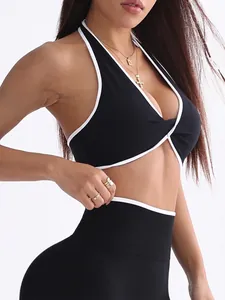 Reggiseno sportivo nero da yoga con nodo intrecciato e profili bianchi a contrasto
