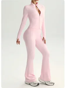 Two-piece pink yoga set with zippered long-sleeve jacket and stylish flared gym pants