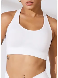 Close-up of white ribbed sports bra showing fabric texture and athletic fit.