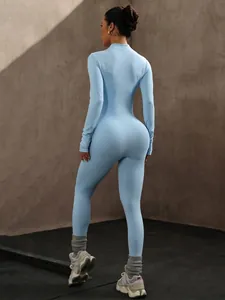 Back view of light blue seamless long-sleeved yoga jumpsuit for fitness and running