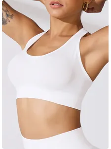 Close-up view of white ribbed sports bra with wide straps and high support design