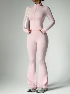 Two-piece pink yoga set featuring a long sleeve zip jacket and flared leggings for women