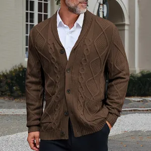 Close-up of brown cable-knit cardigan with shawl collar and button-down detail