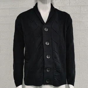 Detailed view of men's black cable knit cardigan sweater featuring large buttons and shawl collar