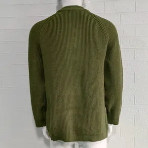 Rear view detail of a men's chunky olive green knit cardigan featuring raglan sleeves