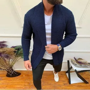 Close-up detail view of navy blue chunky knit cardigan for men with textured pattern