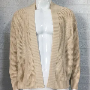 Detailed view of a beige waffle knit men's cardigan featuring an open front design