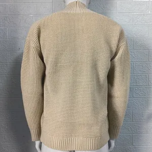 Detailed back view of men's beige chunky knit sweater with honeycomb weave pattern