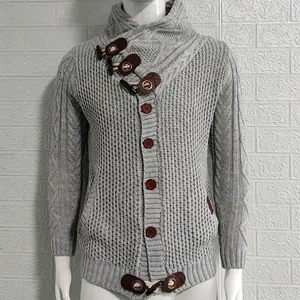 Detailed view of grey cable-knit men's cardigan featuring unique toggle buttons and high neck