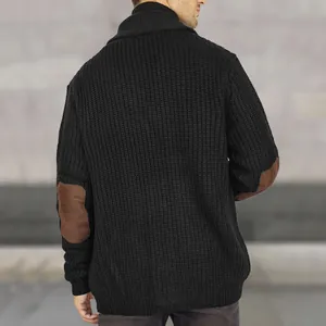 Detailed rear view of a black knitted cardigan featuring brown suede elbow patches