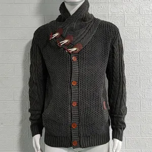 Detail view of men's chunky cable knit cardigan with toggle buttons and a high collar