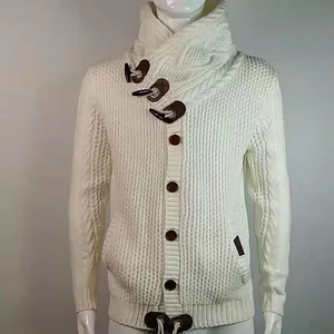 Close-up of men's cable knit cardigan featuring a high collar and toggle button details