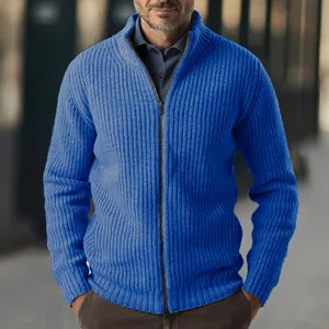 Close-up detail of a blue ribbed knit men's cardigan with a functional zipper.