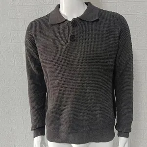 Close-up of men's grey waffle-knit polo sweater featuring detailed buttoned collar texture