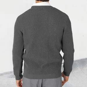 Back view detail of a men's dark grey ribbed knit sweater jacket over a white shirt.