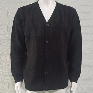 Detailed texture of men's black V-neck knitted cardigan sweater with buttons and long sleeves.