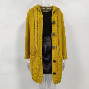 Detailed view of women's mustard yellow cable knit hooded cardigan with black buttons.