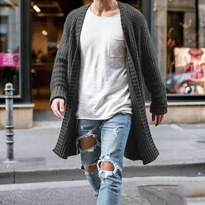 Detail view of men's long charcoal knit cardigan with waffle texture in street style.