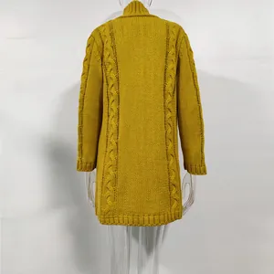 Back view detail of an oversized long mustard yellow cable-knit cardigan sweater for women.