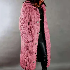 Close-up detail of a pink chunky cable knit long cardigan for women with large buttons