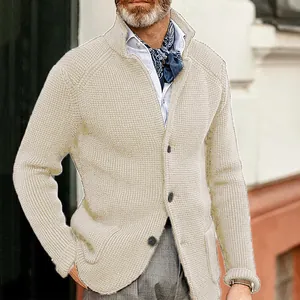 Close-up detail of cream men's slim fit waffle knit cardigan featuring a stand collar.